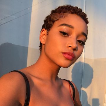 instagram of amanda stenberg looking at the camera with a short curly hair cut